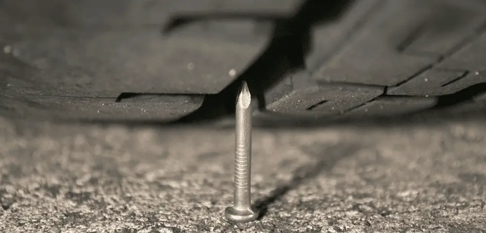 Tire driving over nail